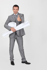 Architect with plans and a hard hat