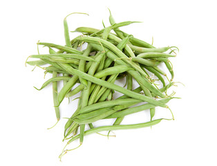 raw long green beans over white background