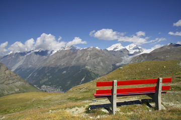 beautiful views of the mountain landscape with red bench