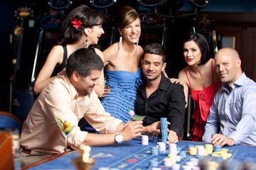 young beautiful people having fun at the casino
