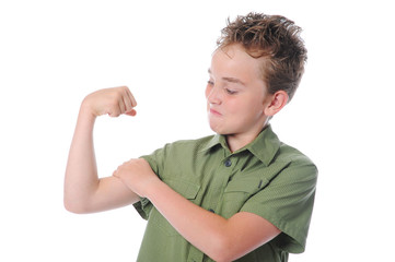 The boy shows his muscles