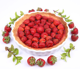 Strawberry Tart decorated with strawberries and mint twigs