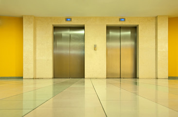 Two elevator doors in a luxurious building © Deyan Georgiev
