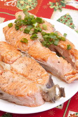 plate with tasty salmon garnished with vegetables