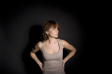 Fototapeta premium Portrait of a beautiful girl on black background