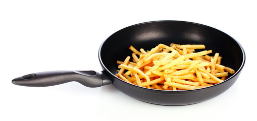 French fries in the pan isolated on white