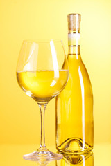 White wine on yellow background