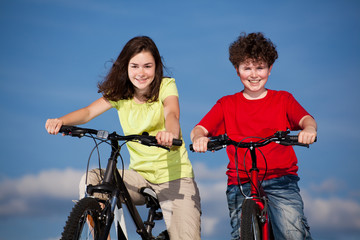 Girl and boy riding bikes