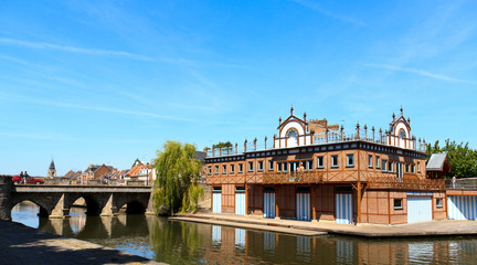 Boat house in the center of Amiens, France. On the shore of the