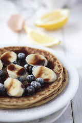 Freshly prepared crepes with banana & chocolate sauce