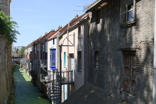Old houses along a canal in Amiens, France