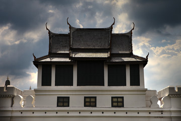 Thai temple with cloudy