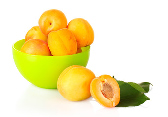 apricots with leaves isolated on white