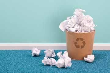 Recycle waste paper basket on office floor