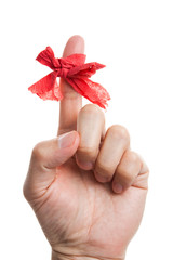 Red bow on finger