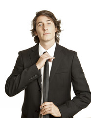 confident young businessman against white background