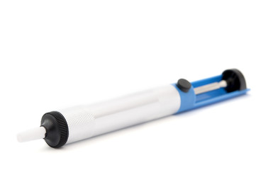syringe for suctioning the solder