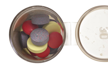 Pill bottle with pills - very shallow depth of field