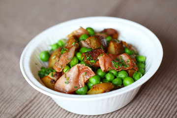 Green pea, baked potato and ham salad with dill.