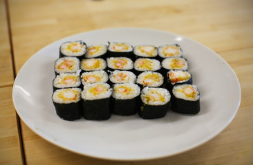 Sushi maki rolls with tempura king shrimp