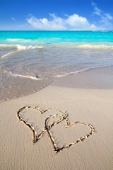 hearts in love written in Caribbean beach sand