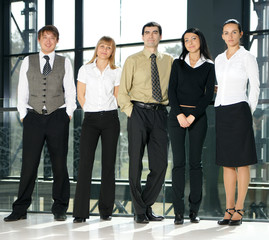 Five young businesspersons in formal clothes