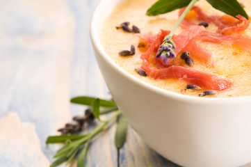 fresh melon soup with parma ham and lavender flower