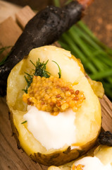 Baked potato with sour cream, grain Dijon mustard and herbs