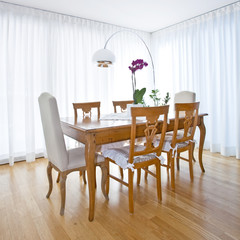 modern dining room with white curtains