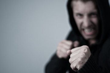 aggressive young man in boxing position