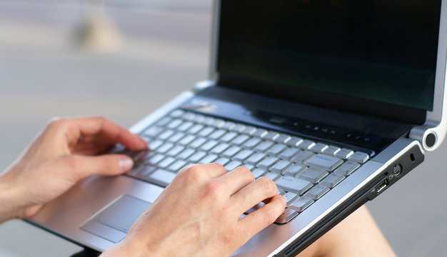 Close-up image of someone working on the notebook