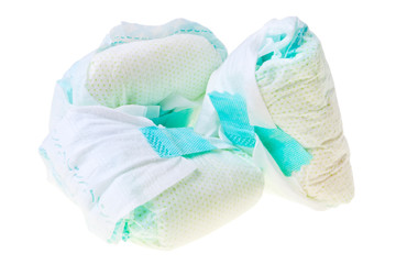 Used disposable baby diapers isolated over white background.