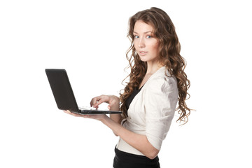 Young female working on laptop isolated on white background