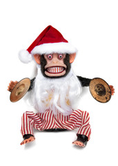 Vintage mechanical monkey toy with santa hat and beard