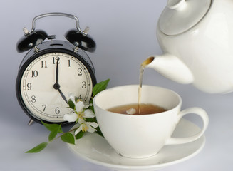 Tea being poured into tea cup