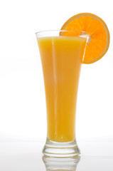 glass of orange juice with slice