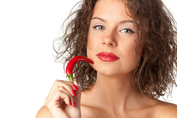 Closeup portrait of young female holding red hot chili pepper