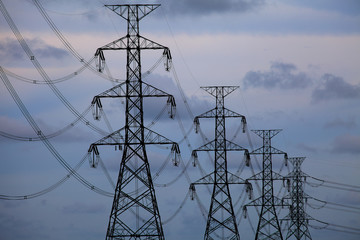 Electrical towers on blue sky background