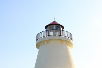 White light house in blue sky