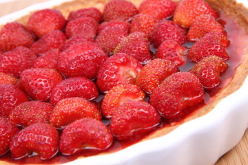 Strawberry Tart in a tart pan on a wooden background