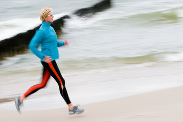 Woman running  at the beach