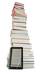 Tall stack of books and e-book reader on the white background