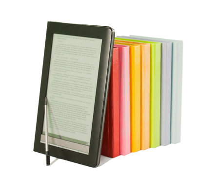 Row of colorful books and electronic book reader