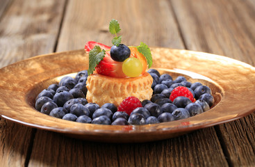 Custard filled puff pastry and blueberries