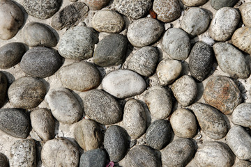 Stones in concrete.