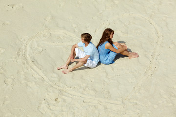 Fototapeta na wymiar Sitting on sand