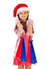 Beauty Santa girl offering shopping bags