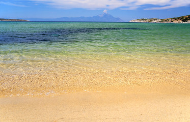 Obraz premium Greek beach at Sithonia, Greece, Mount Athos at the background