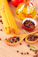 Pasta spaghetti with tomatoes, olive oil, peper  and basil on a