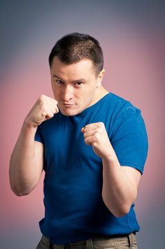 young man standing in a boxing position